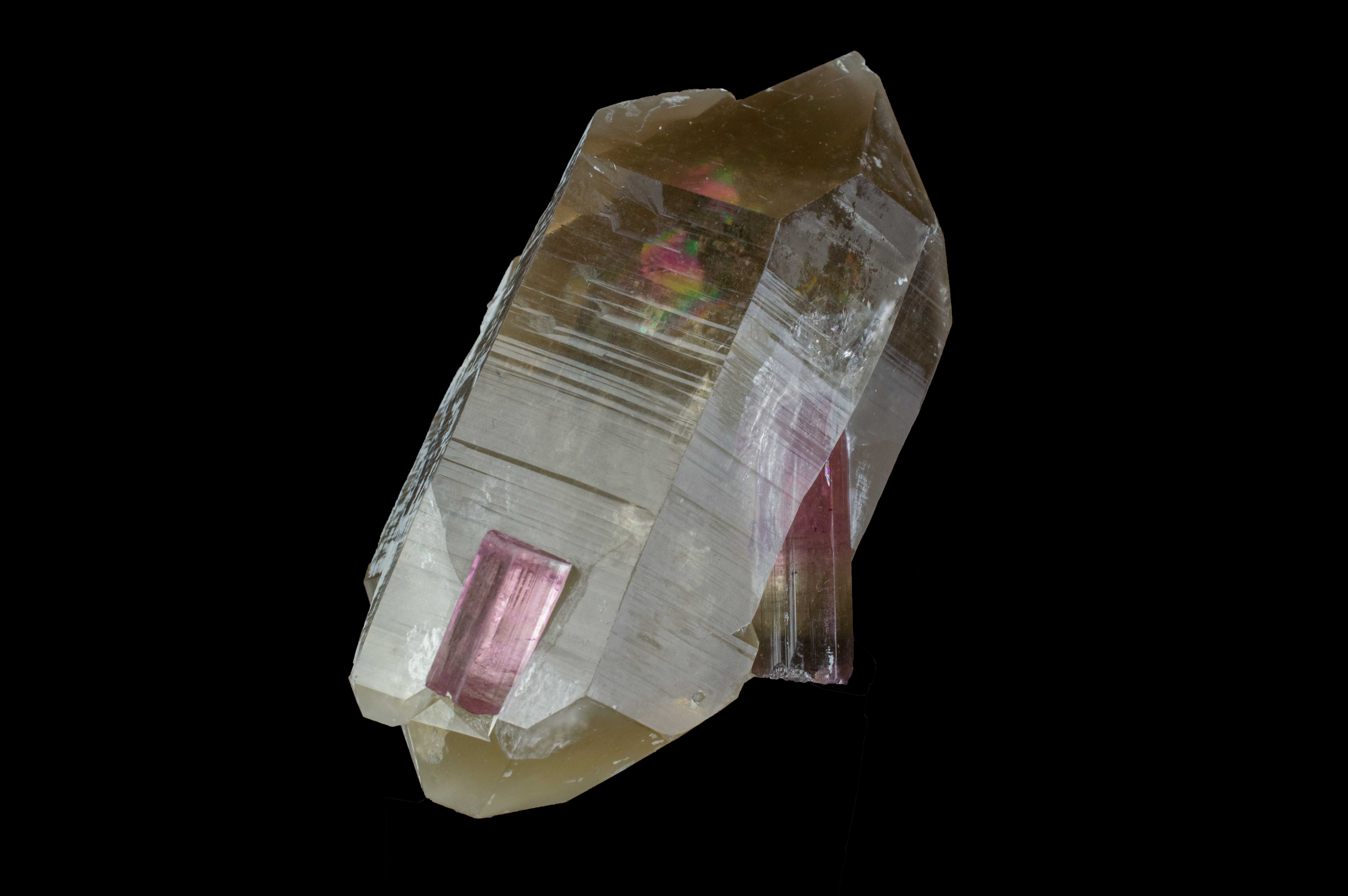 Close-up photo of Smoky Quartz point with Pink Tourmaline embedded in sides
