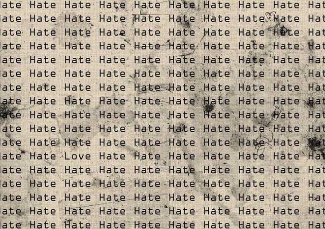 The word "Hate" is typewritten and repeated row after row on weathered paper