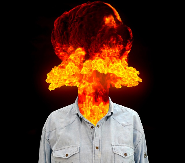 Photo of man with head replaced with fire to signify rage.
