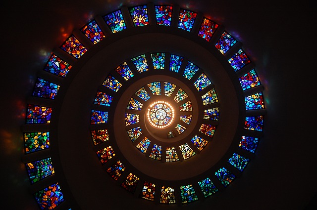 Photo of stained glass window in church in shape of spiral